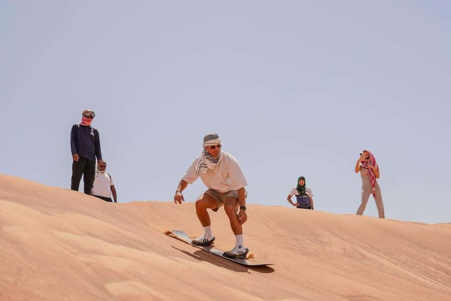 Desert Safari Dubai with Camel Ride, Sandboarding & Dinner - Dune bashing in a Land Cruiser