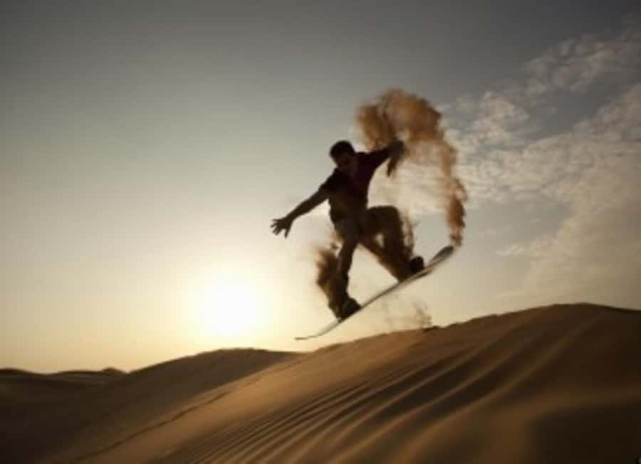 Desert Safari, Quad Bike, Camel Ride, Falcon & Sandboarding - Returning to Doha in comfort