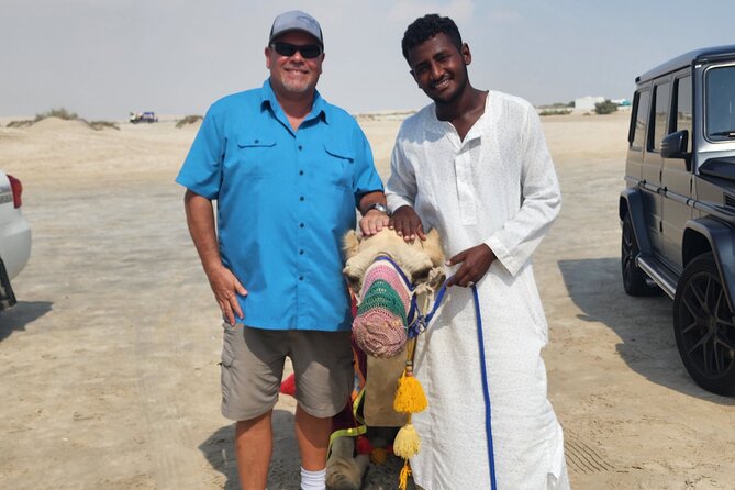 Desert Safari with Sandboarding and Inland Sea Private Tour - Sandboarding for a simple burst of fun