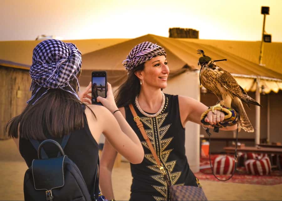 Doha: ATV Quad Bike and Buggy Desert Safari with Camel Ride - Meeting camels and falcons with local hosts
