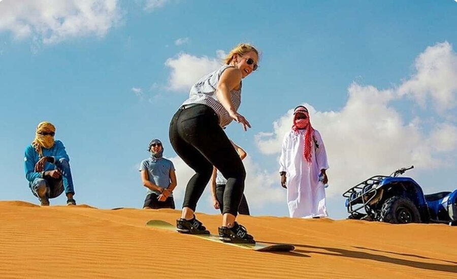 Doha: ATV, Quad or Buggy, Dune Bashing, Camel & Sandboarding - Quad biking across open sand
