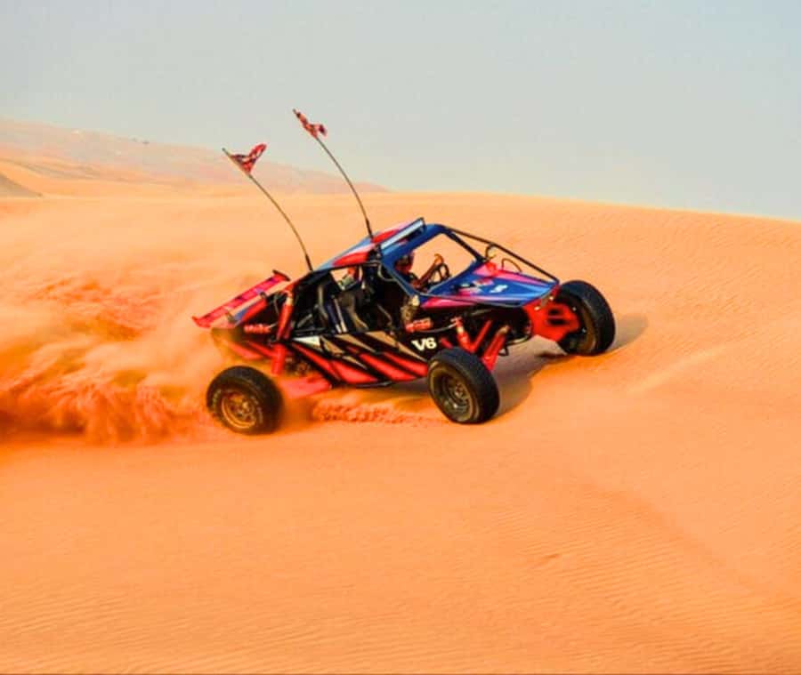 Doha: Desert Safari, Camel Ride, and Sandboarding Tour - Sandboarding and one hour of dune bashing