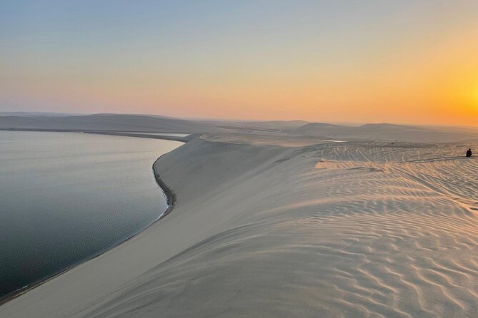Doha: Desert Safari, Sand Boarding, Camel Ride & Inland Sea Tour - Dune bashing across the Qatari desert