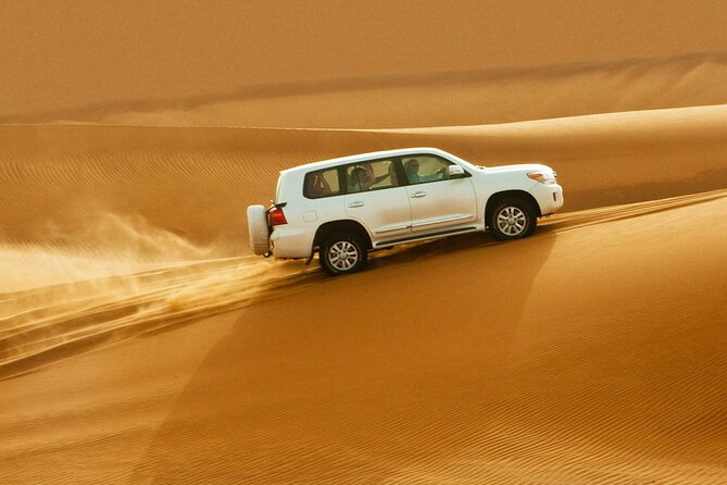 Doha: Desert Safari, Sand Boarding, Camel Ride & Inland Sea - Sandboarding and the first rush of dune bashing