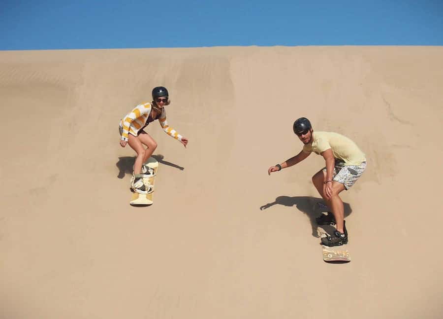Doha Desert Safari: Sandboarding, Camel Ride & Swimming Fun - Khor Al Adaid, where desert meets sea