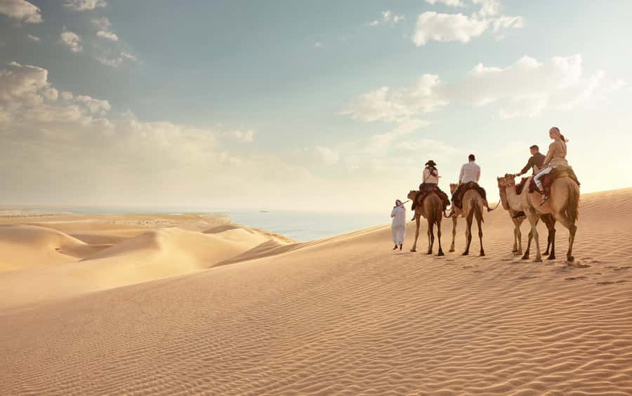 Doha: Desert Safari with Dune Bashing and Inland Sea - Mesaieed brings camels, photos, and the first dunes