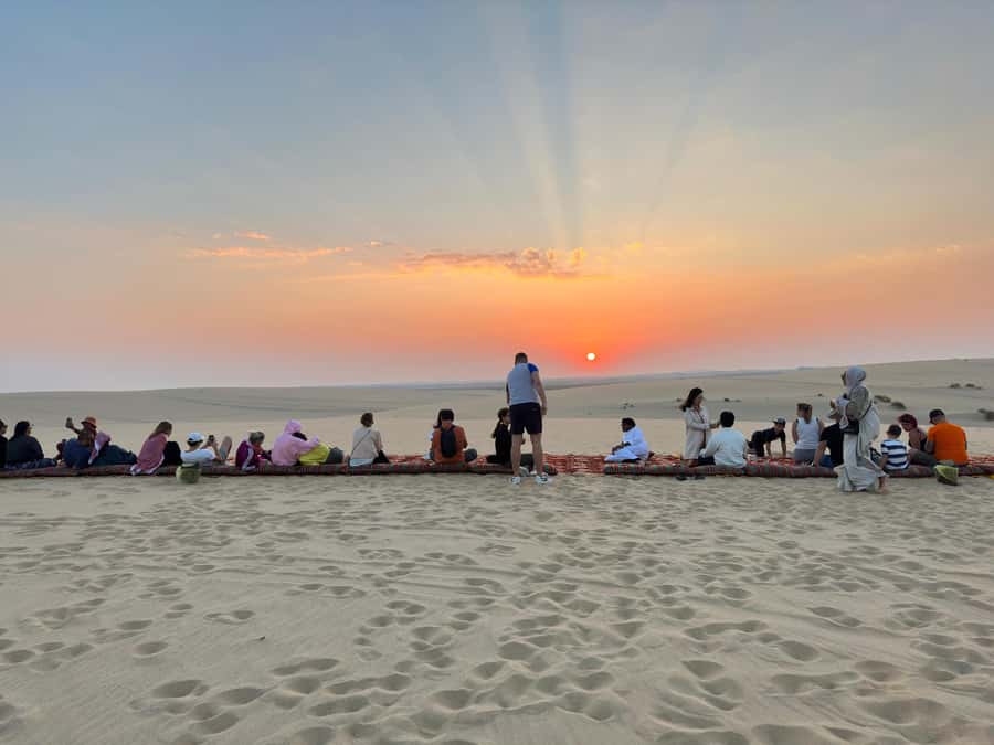 Doha: Half-Day Desert Safari, Quad Bike, Camels & Inland Sea - Sandboarding down the dunes