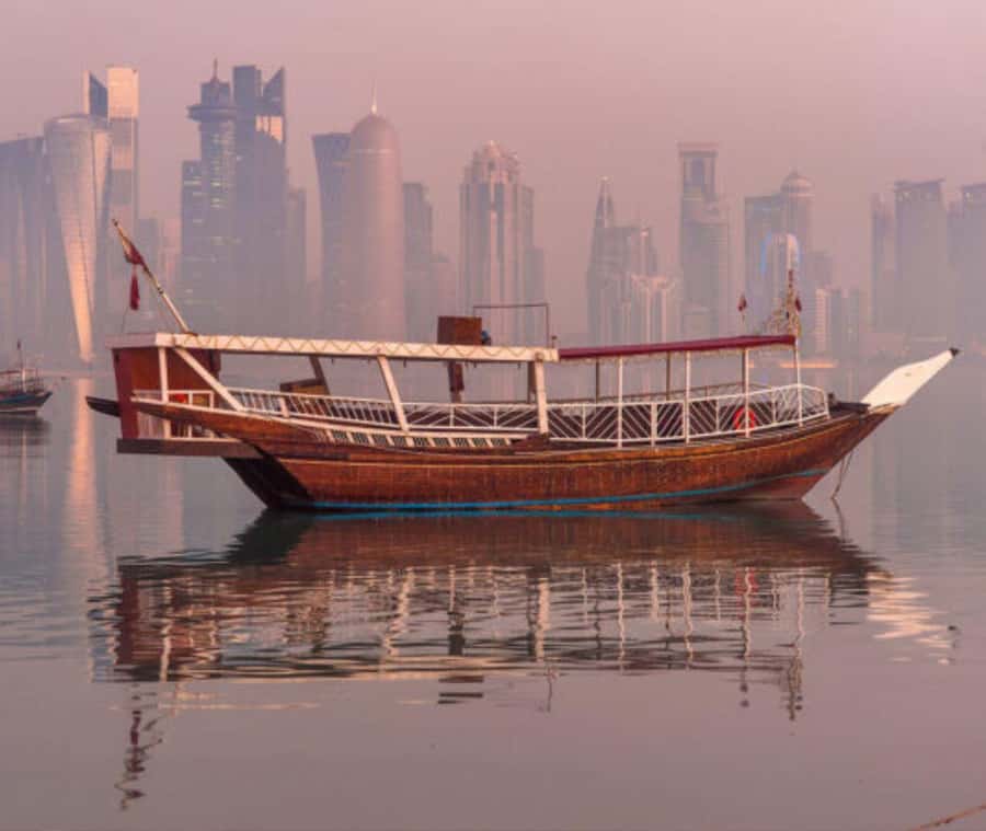 Doha : Harbor Dhow Cruise Tour with Refreshments & Transfers - Boarding a Traditional Wooden Dhow