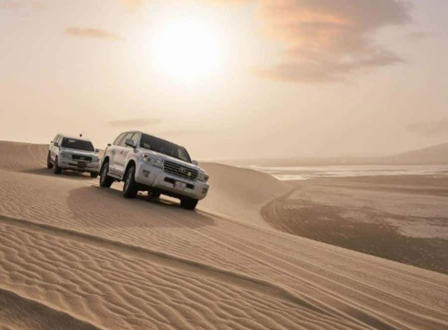 Doha : Inland Sea Desert Safari ,Camel Ride & Sandboarding - Dune bashing in a Land Cruiser