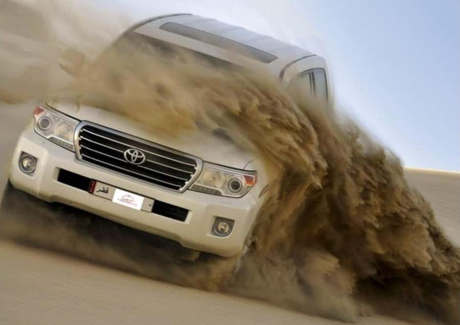 Doha : Inland Sea Desert Safari ,Camel Ride & Sandboarding - Sandboarding on the dunes