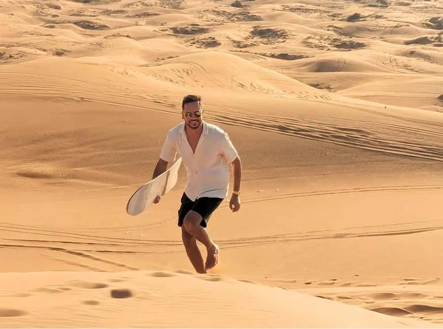 Doha: Inland Sea Desert Safari With All Activities - Sandboarding for a simple burst of fun
