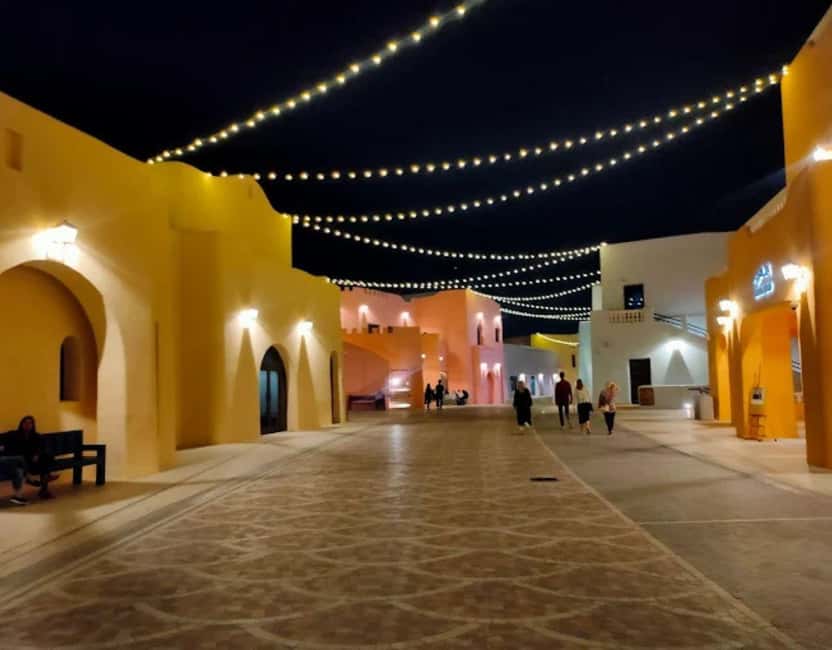 Doha: Mina District's Colorful Streets & Coastal Vibes Tour - Pickup and the Short Ride to the Port