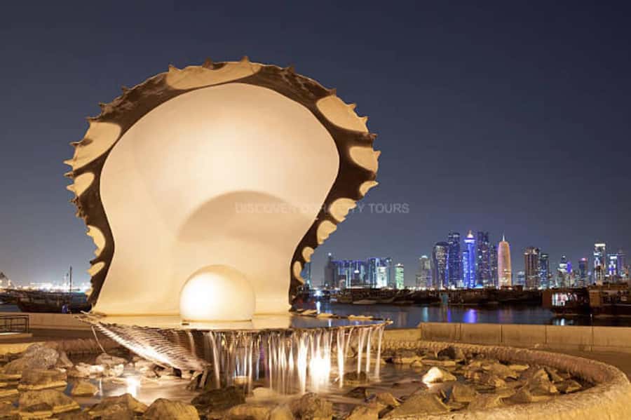 Doha: Night City Lights Tour with Arabian Dhow Cruise - Katara Cultural Village after dark