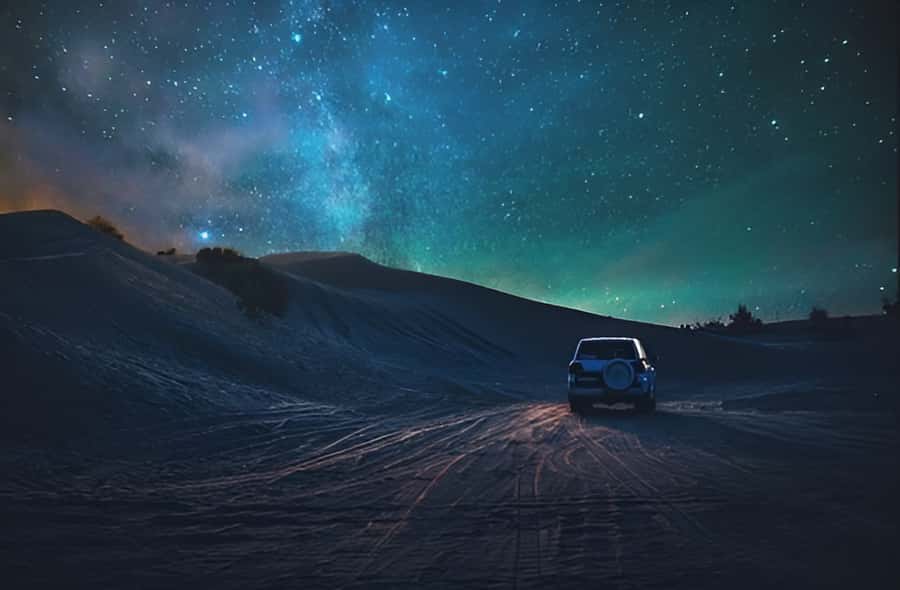 Doha: Overnight Desert Safari with 4x4 Ride and Camp Stay - Dinner, fire, and desert darkness