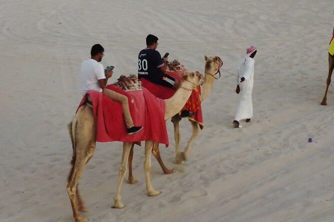 Doha-Private Half Day Safari Camel Ride and Sandboard included - Dune bashing across Qatar’s sand