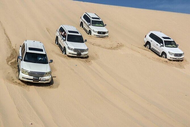 Doha Qatar ATV Quad Bike Buggy Desert Adventure and Camel Ride - Khor Al Adaid, where sand meets the Gulf