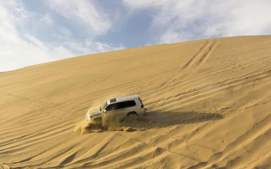 Doha: Safari ATV Ride Dunes Bashing and Camel Ride - Sunset, photos, and time in the sand