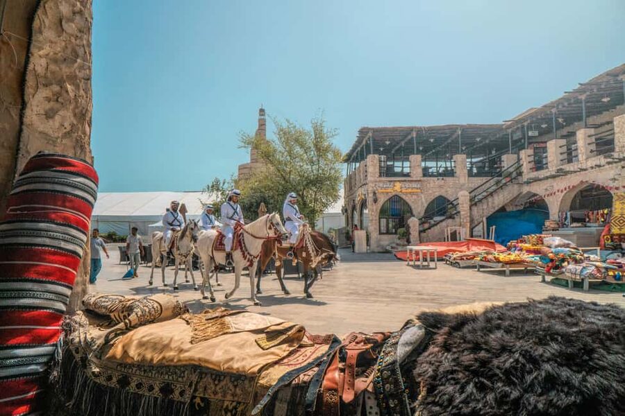 Doha: Souq Waqif, Dhow Harbour, and Street Food Walking Tour - Tea and street snacks at an outdoor café