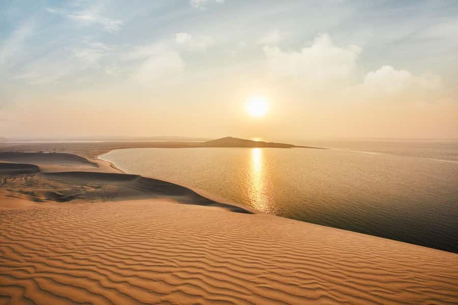 Doha:Sunrise or Sunset Desert Safari Tour with Sand Boarding - Sandboarding on the Dunes