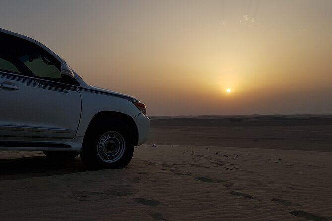 Doha: Sunrise /Sunset Desert Safari with Sand Boarding,Camel ride - Sand boarding without a separate adventure booking