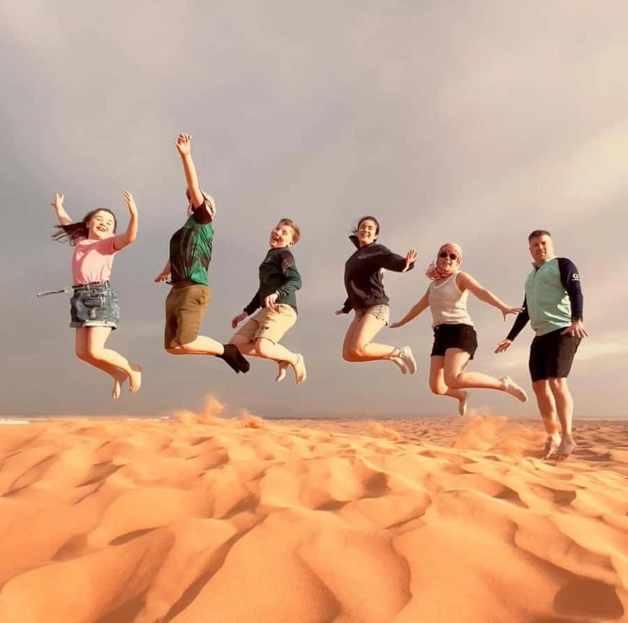 Doha: Sunset Desert Safari with Camel Ride & Sandboarding - Dune bashing across Qatar’s sand