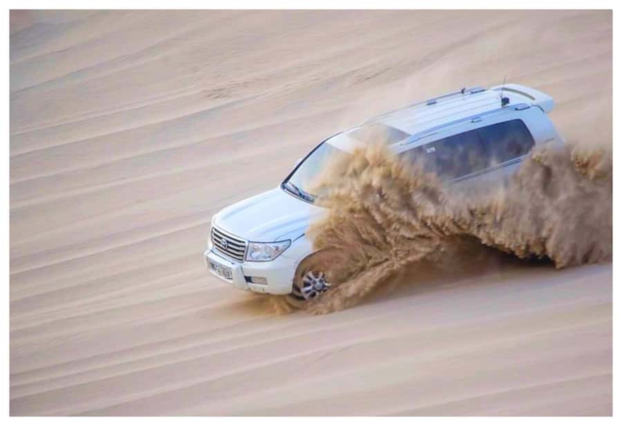Dune Bashing, Sandboarding, Camel Ride & Optional ATV Ride - A short camel ride and traditional tea stop