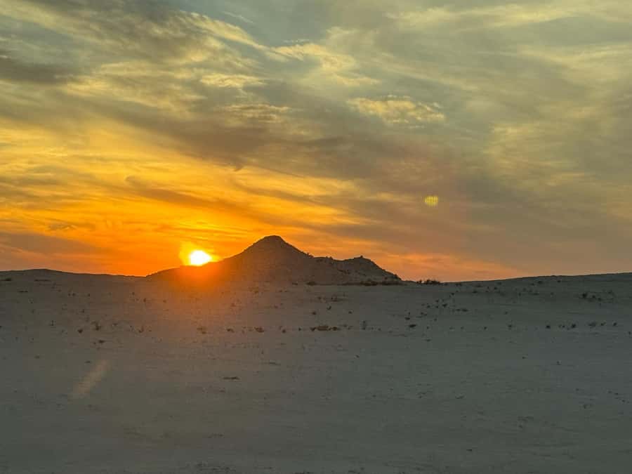 Explore West Qatar and Sheehaniya Camel racetrack visit. - Walking among Zekreet’s mushroom-shaped rocks