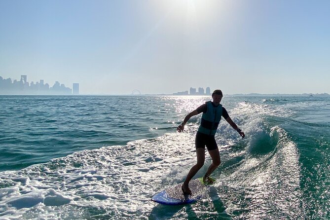 Private Wakesurfing or Wakeboarding along Doha's skyline - A water sport with Doha in the background