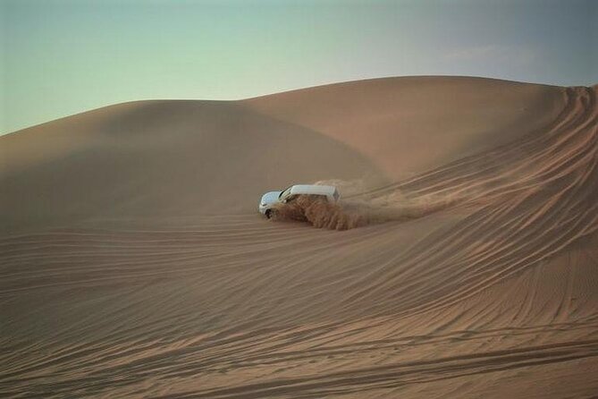 Qatar Sunset Desert Safari: Dune Bashing & Golden Sands Adventure - Two hours of dune bashing across the sand
