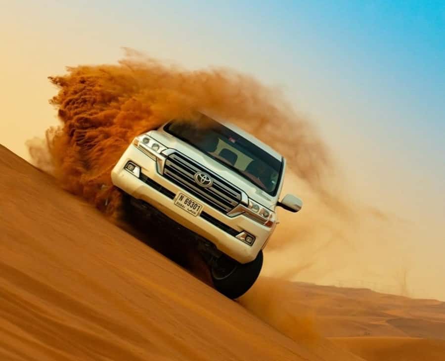 Qatar: Sunset Desert Safari with Camel Ride & Sandboarding - Dune Bashing Toward The Inland Sea