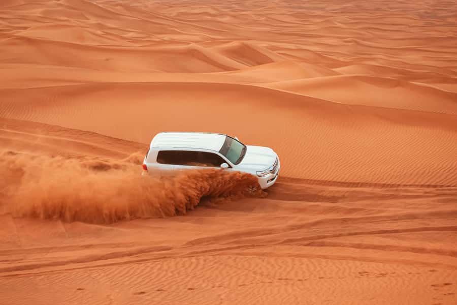 Quad Biking & Private 4x4 Doha Desert Safari Tour - Sealine Beach Resort: sandboarding and camel time