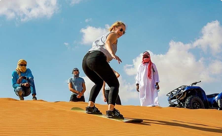 Sunrise/Sunset DuneBashing,CamelRide InlandSea &Sandboarding - Sandboarding on smooth dunes
